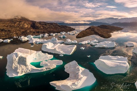 10.GRN_DJI_0254_0265.HP_ 
Greenland, September 2022
M/S Freya  Expedition 
East Greenland Scoresby Sound  fjord system 
Sunset, Icebergs
Taken from DJI Drone