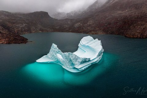 10.GRN_DJI_0347_0350.P.DR_ 
Greenland, September 2022
M/S Freya  Expedition 
East Greenland Scoresby Sound  fjord system 
Iceberg, arches 
Taken from DJI Drone