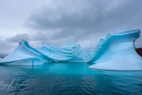 06.GRN_SM05502 
Greenland, September 2022
M/S Freya  Expedition 
East Greenland Scoresby Sound  fjord system 
 Iceberg   city (from Zodiac)